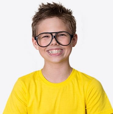 Smiling young boy with braces