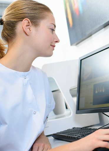 person working on a computer on the scans