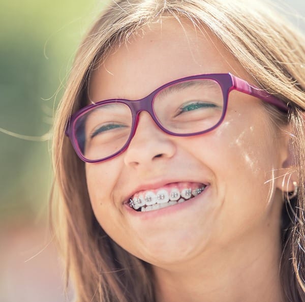 Closeup of child smiling with braces