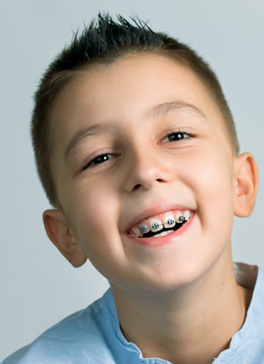 Close up of boy smiling with braces