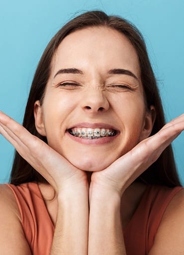 Closeup of teen with braces smiling