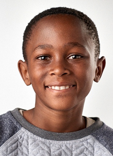 Portrait of smiling little boy enjoying benefits of Myobrace