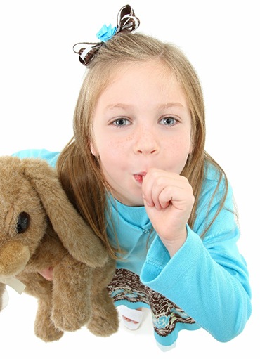 Girl sucking her thumb, may need myofunctional therapy