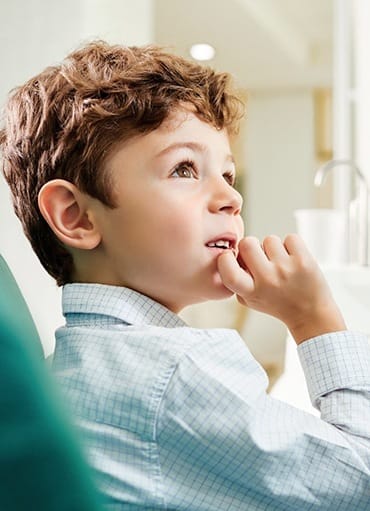 Dentist showing child their X-ray