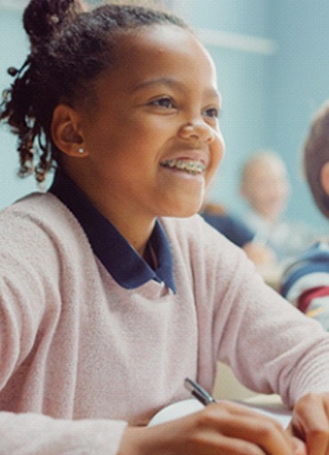 Girl wearing braces while in school in Glenpool