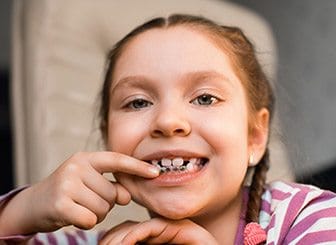 Young girl with orthodontic appliance