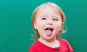 Child sticking out tongue