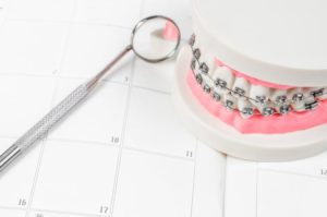 braces sitting on top of a calendar 