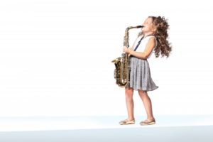 little girl playing saxophone