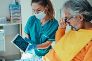 orthodontist showing patient their x-ray