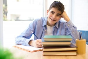 teen with braces smiling