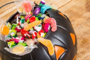black plastic pumpkin filled candy