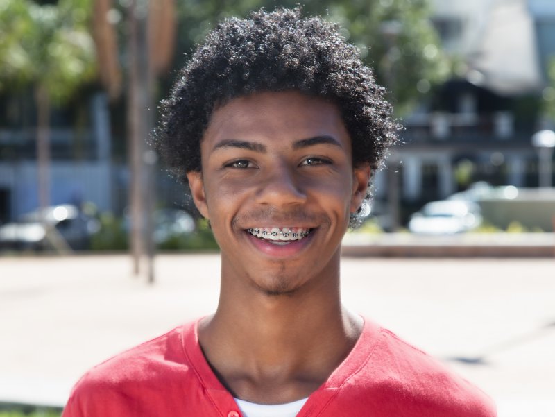 Young man with black bands on his braces