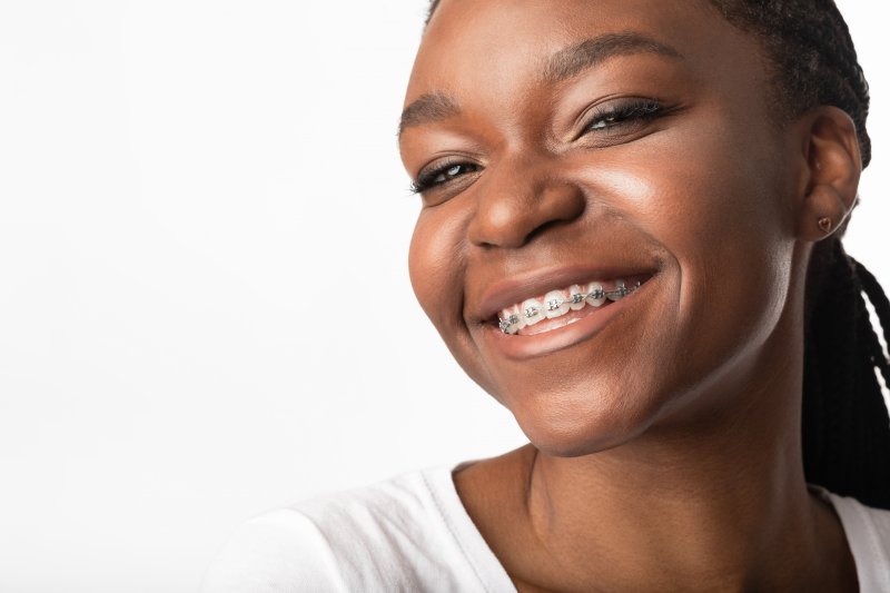 smiling person with braces